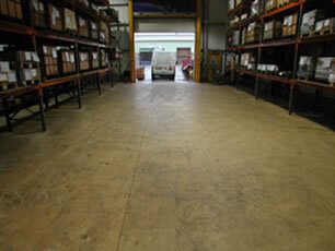 Warehouse Before Self Smoothin Resin Flooring Treatment