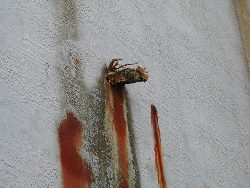 Inside tank and corroded walls before surface preparation.